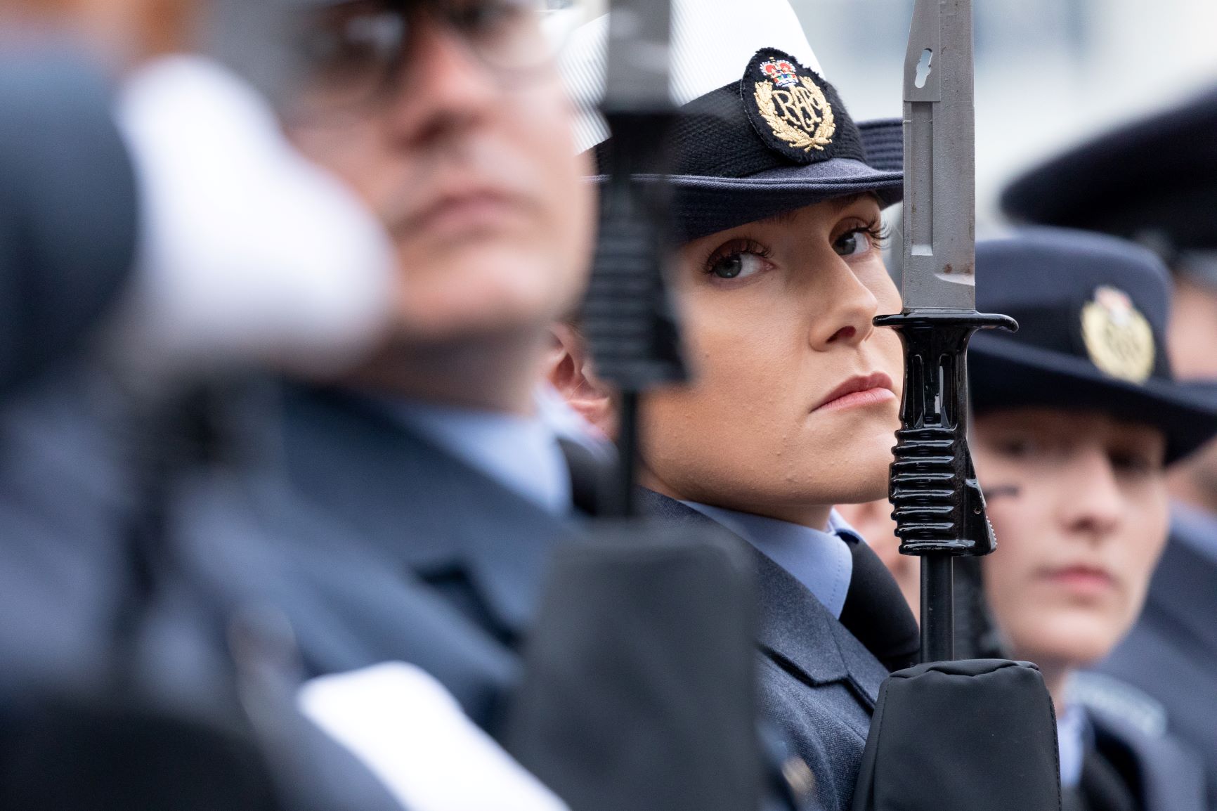 RAF Aviators hold rifles during parade.